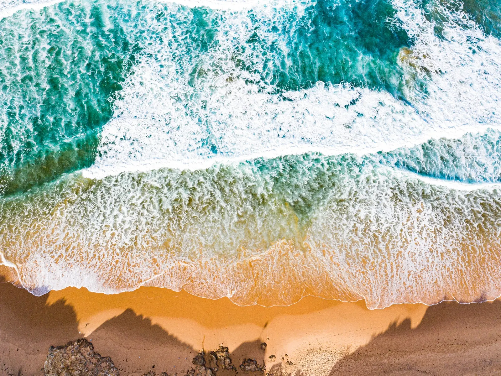 Aerial view of Cape Woolamai's headland and surf beach on Phillip Island.